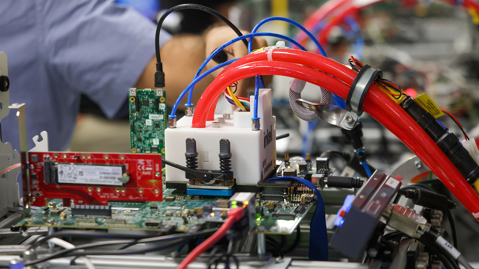 Lines of test benches for testing chips at Intel's IDC lab.