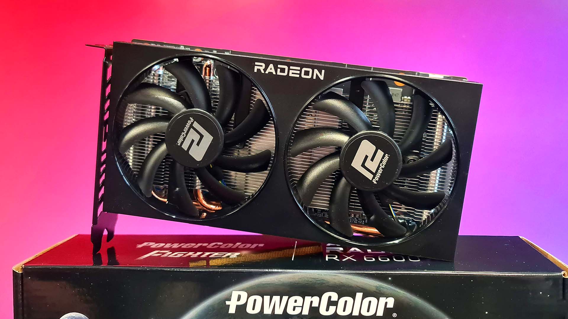 AMD Radeon RX 6600 graphics card on colourful background.