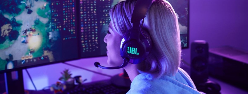 Gamer wearing JBL Quantum headphones