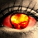 A nuclear explosion reflected in an eye.