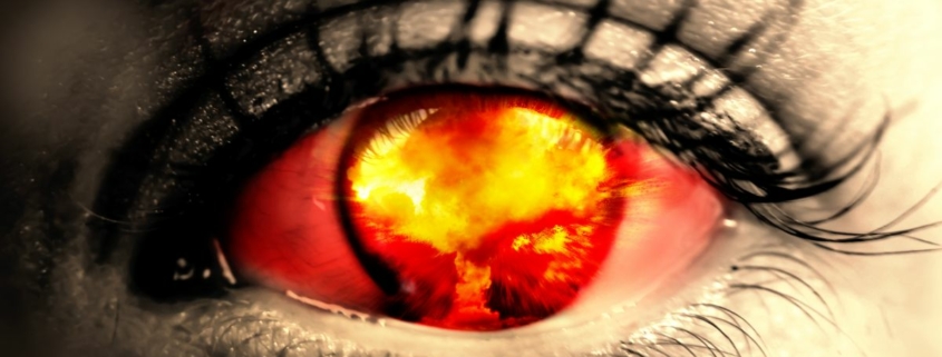 A nuclear explosion reflected in an eye.