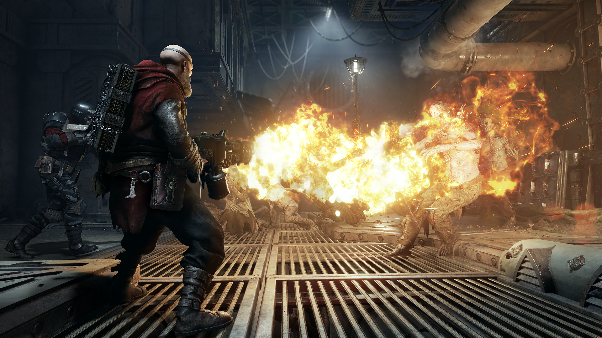 A screenshot of Warhammer 40,000: Darktide where a Zealot attacks enemies with a flamer