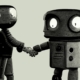 Two robots shaking hands.