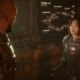 Two characters in science-fiction mining equipment talking to each other from game The Callisto Protocol