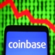 Coinbase logo with downward trend arrow.