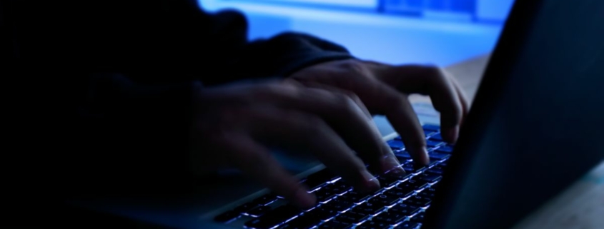 Hacker hacking away on a keyboard.