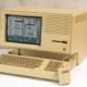 An Apple Lisa home computer with GUI displayed.