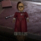 A screenshot of a creepy doll from Sherlock Holmes: The Awakened.