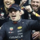 Max Verstappen of Red Bull Racing poses for a photo with the team after the Formula 1 Abu Dhabi Grand Prix at Yas Marina Circuit in Abu Dhabi, United Arab Emirates on November 20, 2022.