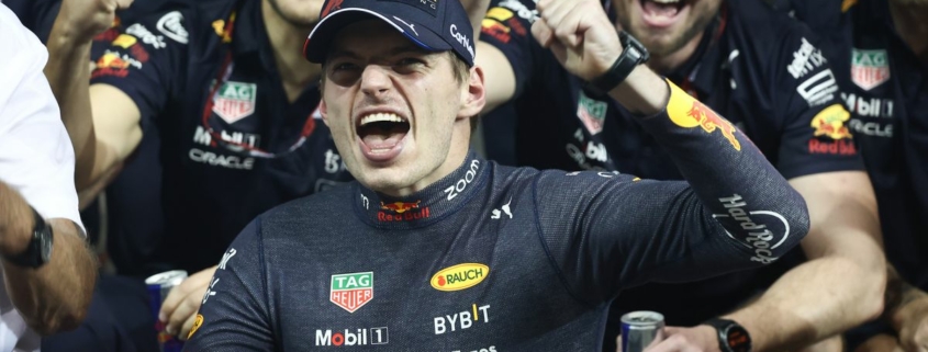 Max Verstappen of Red Bull Racing poses for a photo with the team after the Formula 1 Abu Dhabi Grand Prix at Yas Marina Circuit in Abu Dhabi, United Arab Emirates on November 20, 2022.