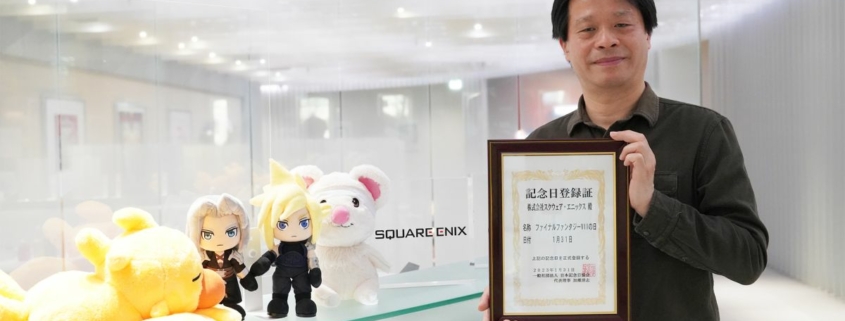 Yoshinori Kitase, producer on FF7 Remake, holding a commemorative certificate marking Final Fantasy 7 Day.