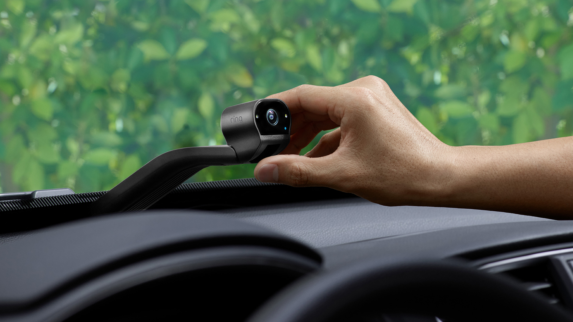 The Ring Car Cam being placed on a dashboard.