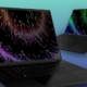 The Razer Blade 18 and Razer blade 16 side by side on a green and purple gradient backgound.