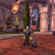 WoW Happy Pet treats - a demon hunter character is standing next to the Gilvanas battle pet in Dalaran. The pet has a red heart floating above it