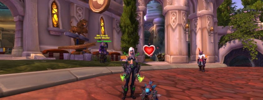 WoW Happy Pet treats - a demon hunter character is standing next to the Gilvanas battle pet in Dalaran. The pet has a red heart floating above it