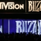 Giant screens displaying Activision and Blizzard logos at E3 2013.