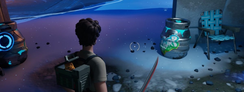 Fortnite - a player stands in the snow looking at a silver slurp barrel