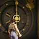 Fortnite - a player stands in front of a large col blooded vault door