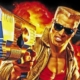 Duke Nukem with arm outstretched, pistol in hand, aiming at the screen