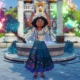 Disney Dreamlight Valley - Mirabel from Encanto standing in front of the plaza fountain, cheering in celebration