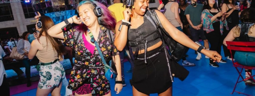 Concert goers dancing at the Silent Disco dance party at Lincoln Center, New York City on Saturday, July 1, 2023.