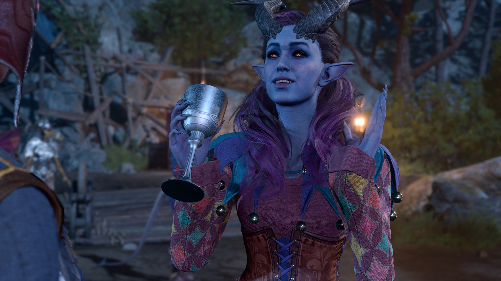 A tiefling bard holds up her drink