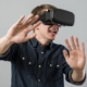 Man with hands out using a VR headset.