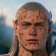 A close-up of an elf face with tattoos.