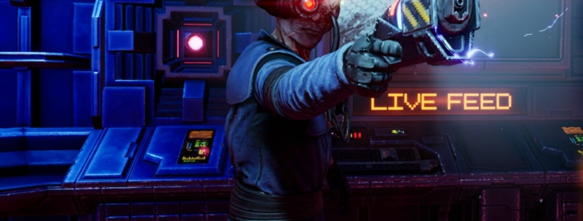 Cyborg man holding a laser pistol in front of monitor that says