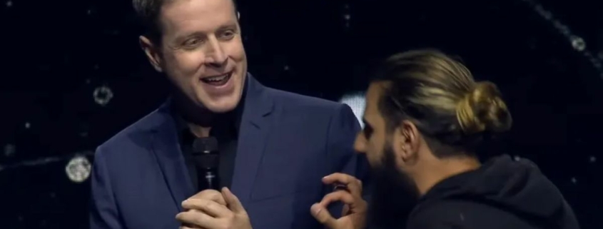 Geoff Keighley is interrupted by a stage crasher during Opening Night Live 2023.