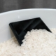 A smartphone sitting in rice