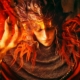 Elden Ring Shadow of the Erdtree trailer screencap of a red haired character holding fire in their hand