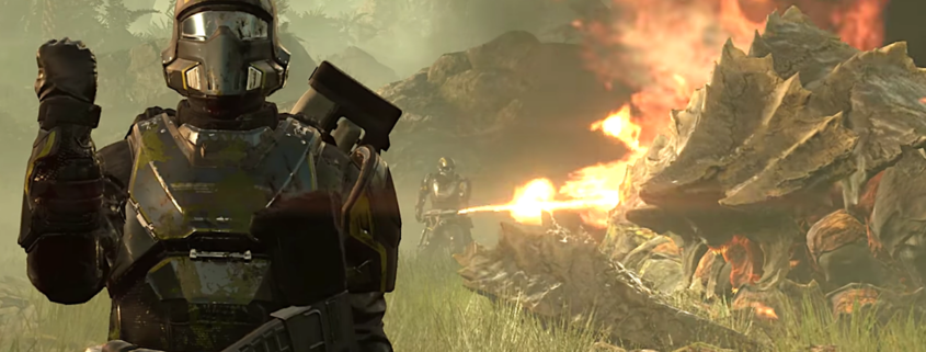 A soldier from Helldivers gives a patriotic salute while their comrade burns an alien corpse to death in the background.