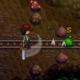 Stardew Valley screenshot - player swinging a sword in a fight against a monster in a mine