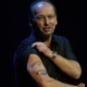 Peter Moore displaying his famous Halo 2 release date tattoo in 2004.