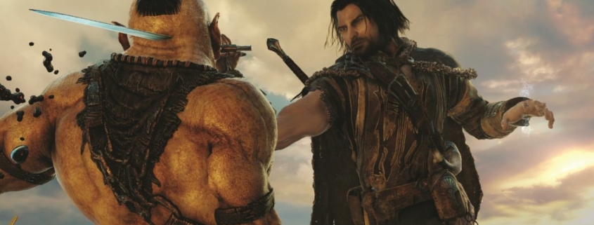 Talion thrusting a blade through the face of an orc