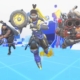 Three Overwatch heroes running toward the screen in a blue and white abstract level environment