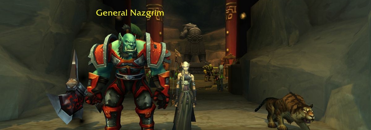 WoW Strongarm Tactics - general nazgrim is standing at a cave entrance with a blood elf player standing next to him
