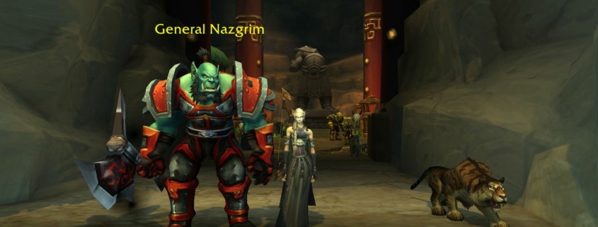 WoW Strongarm Tactics - general nazgrim is standing at a cave entrance with a blood elf player standing next to him