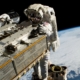 NASA astronaut and Expedition 68 Flight Engineer Woody Hoburg riding the Canadarm2 robotic arm while maneuvering a roll-out solar array toward the International Space Station’s truss structure 257 miles above the Pacific Ocean