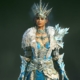 Diablo 4 sorceress wearing a ice-themed skin on a dark background