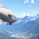 A blimp, flying next to the mountains in Microsoft Flight Simulator 2024