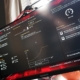 A photo of a gaming monitor displaying the new Asus BIOS page in 1080p.