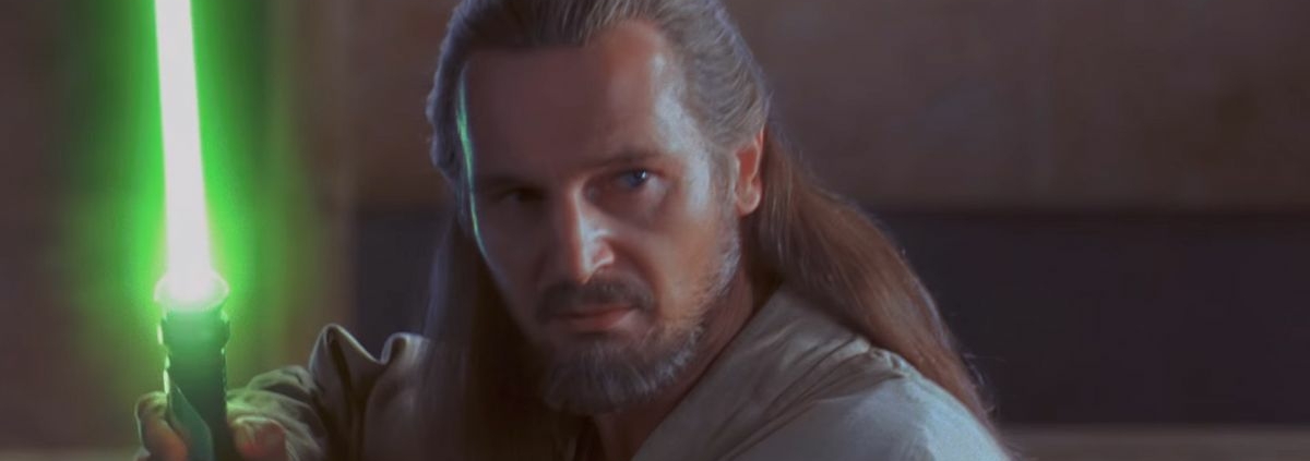 Qui Gon Jinn holding lightsaber in The Phantom Menace