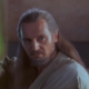 Qui Gon Jinn holding lightsaber in The Phantom Menace