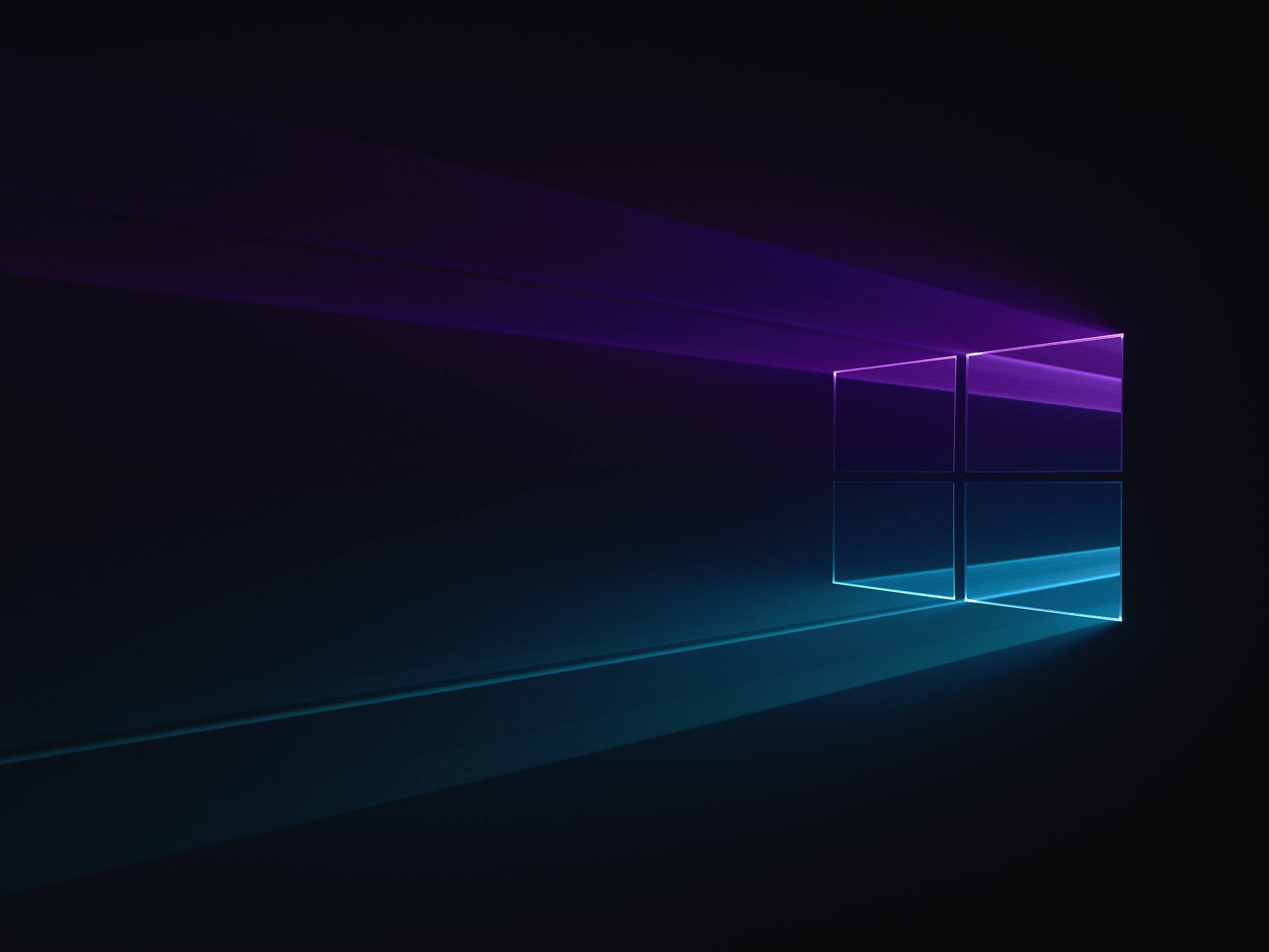 WIP versions of Windows 10 desktop background with light being filtered through a physical windows 10 logo