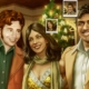 Close up of three people at a Christmas party in The Roottrees are Dead, with picture in picture close ups of each individual's head.