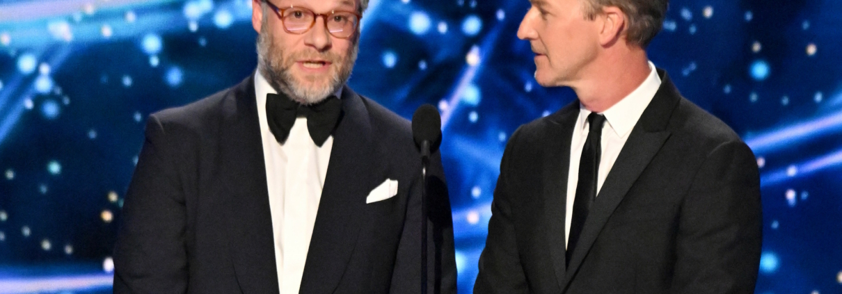 SANTA MONICA, CALIFORNIA - APRIL 05: (L-R) Seth Rogen and Edward Norton speak onstage during the 11th Breakthrough Prize Ceremony at Barker Hangar on April 05, 2025 in Santa Monica, California. (Photo by Lester Cohen/Getty Images for Breakthrough Prize)