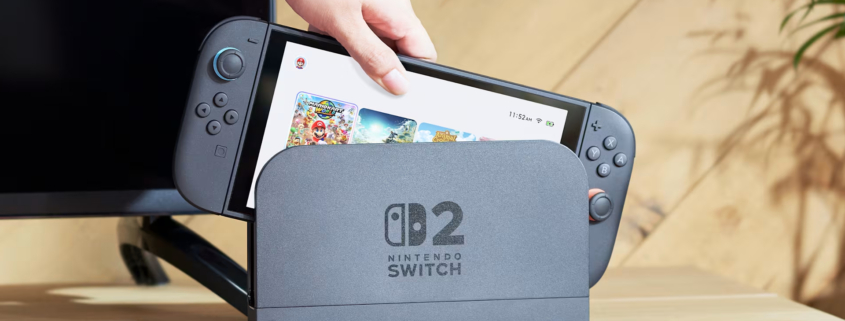 A Switch 2 being removed from its dock.
