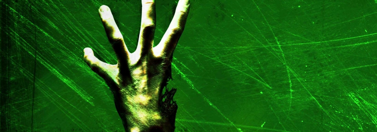 A zombie hand missing a thumb rises into view